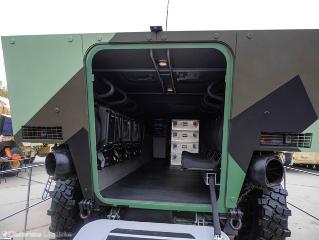 The spacious cabin accommodates eight troops and three crew members. The overhead unmanned turret is mounting the 57mm cannon and up to 100 rounds of ammo. Four containers shown here will provide reloads for the gun. Photo: Noam Eshel, Defense-Update