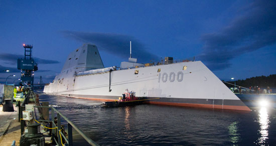 The Zumwalt-class guided-missile destroyer DDG 1000 is floated out of dry dock at the General Dynamics Bath Iron Works shipyard. The ship, the first of three Zumwalt-class destroyers, will provide independent forward presence and deterrence, support special operations forces and operate as part of joint and combined expeditionary forces. Photo: General Dynamics