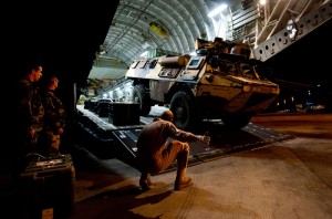 A French Véhicule de l'Avant Blindé (VAB) armoured vehicle being unloaded from an RAF C17, which landed at Bamako airport, Mali in support of Operation Newcombe. Photo: UK MOD, Croen Copyright