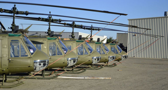 A line of refurbished Huey UH-1H Iroquois helicopters parked at Rice Aircraft in northern California. The Huey is a popular platform operating with many third world air forces.  Photo: Rice Aircraft