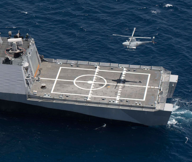 MQ-8B Fire Scout unmanned helicopter prepares to land on the littoral combat ship USS Freedom (LCS 1) off the coast of Southern California. The training marked the first time a littoral combat ship, an MQ-8B Fire Scout unmanned helicopter and an SH-60R Sea Hawk helicopter conducted integrated training. Photo: US Navy