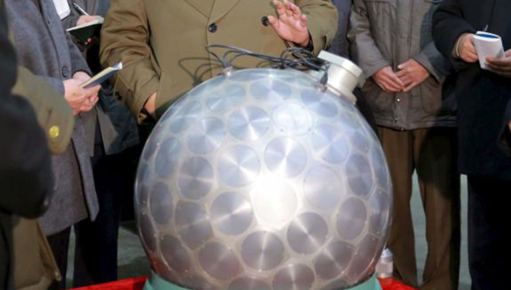 North Korean nuclear fission warhead displayed to leader Kim Jong Un. [ismember]The design shows the outer layer containing multiple detonators using lense shaped charges, activated simultaneously to cause an 'implosion' that triggers the plutonium core into chain reaction. Implosion devices are more efficient than the gun type and do not require high-grade uranium, but they are more complex in their design and more delicate, requiring precise coordination of the timing for the detonation of the surrounding explosive charges.[/ismember] Photo: KCNA.