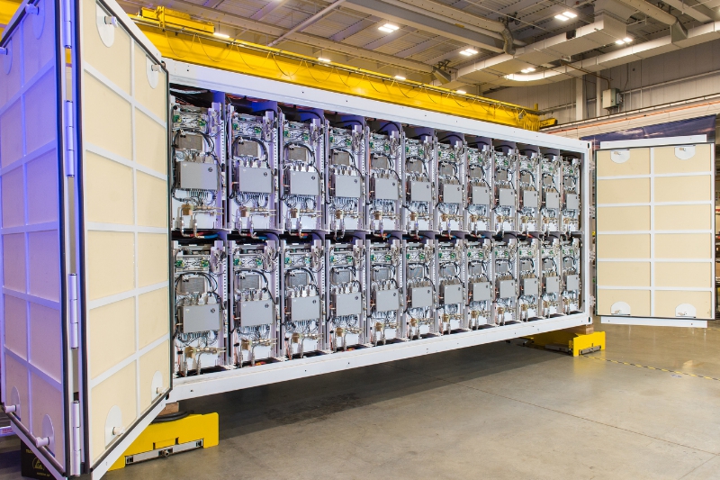 Raytheon has completed the first examples of containerized pulse power packs designed to support field tests of the electromagnetic rail gun. Photo: Raytheon. 