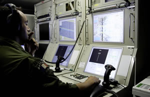 Operators at the Harfang ground control station in Sicily monitor the aircraft electro-optical and radar payloads over a satellite communications link. The data collected on the 15 hour mission provides live intelligence day and night.  Photo: EMA / armée de l'Air