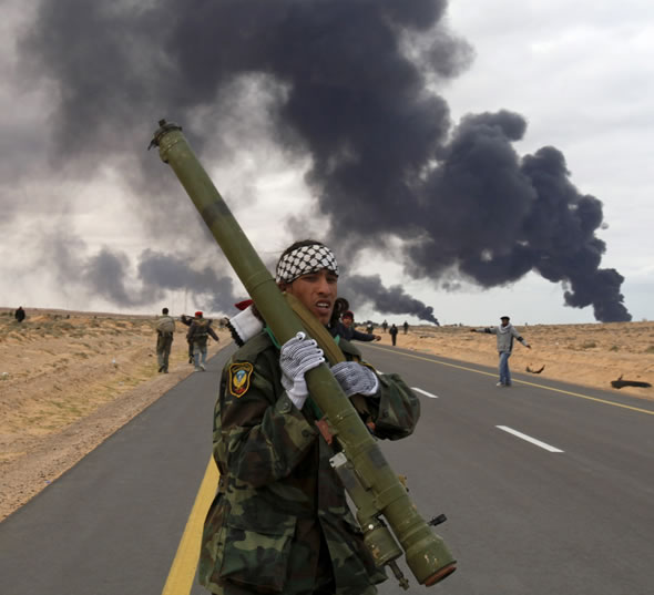 Rebel fighter holds an SA7 missile captured from Pro-Gaddafi arsenals in Benghazi.