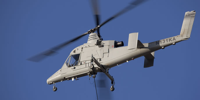 The autonomous K-MAX unmanned helicopter  will provide air transportation for the UGV, which will independently continue the mission relying on its integral sensors and situational understanding. Photo: Lockheed Martin