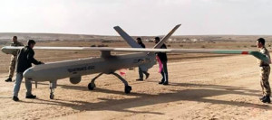 British troops from 32 Regiment Royal Artillery, assisted by contractor personnel, practice flight preparation of Hermes 450 UAV at a flight strip somewhere in the Middle East, representing conditions similar to those experienced in the Southern Iraqi desert.