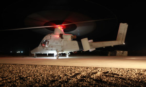 A K-MAX helicopter with Marine Unmanned Aerial Vehicle Squadron 1 rests on a Helipad prior to liftoff for a supply mission in Helmand province, Afghanistan, April 30. The K-MAX has flown more than 400 missions supporting Marines at various locations. Photo: US Marine Corps Cpl. Isaac Lamberth