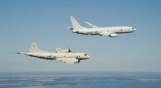 The P-8A arriving at Patuxent River, flying in formation with the P-3C off the coast of Maryland.