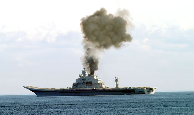 Smoke pillowed from the Vikramaditya as she sailed the Barnets Sea on its first sea trial. Despite the crew's efforts to reach top speed, the vessel didn't make it, due to faulty boiler insulation.