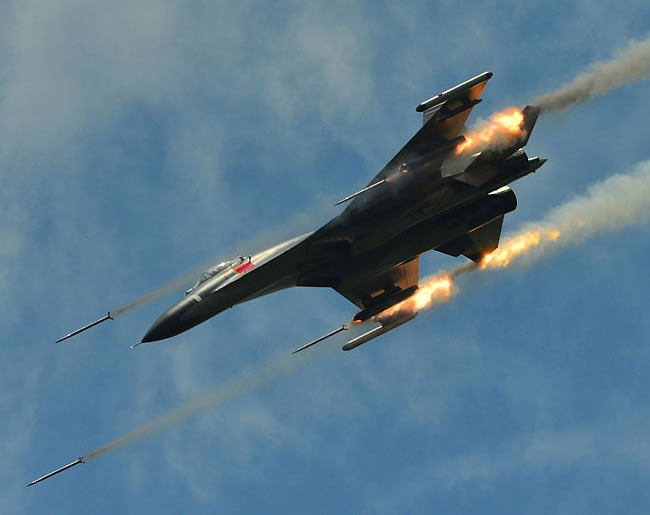 PLAAF J-11 fires rockets on an air-ground mission.