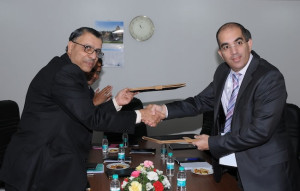 Mr H N Ramakrishna, Director (Marketing), BEL, and Mr Adi Dar, Executive VP, Managing Director of Elbit Systems Electro-optics-Elop Ltd., Israel, exchange documents after the signing of the MoU at Aero India 2013 in Bengaluru.