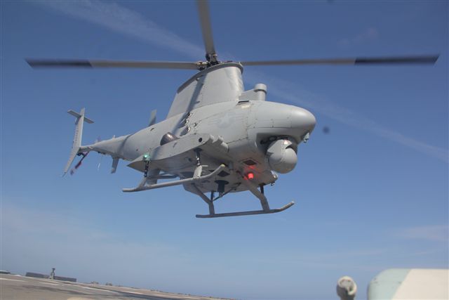After exceeding the 8,000-flight-hour mark Friday, an MQ-8B Fire Scout assigned to Helicopter Sea Combat Squadron 22 Detachment 5 prepares to land aboard USS Robert G. Bradley for a "hot pump" and re-launch while conducting maritime intelligence, surveillance and reconnaissance (ISR) operations in the Mediterranean Sea March 11. Fire Scouts aboard Bradley are routinely flying 17-hour days while providing 12 hours on station ISR coverage in the U.S. Africa Command area of responsibility. (U.S. Navy photo)