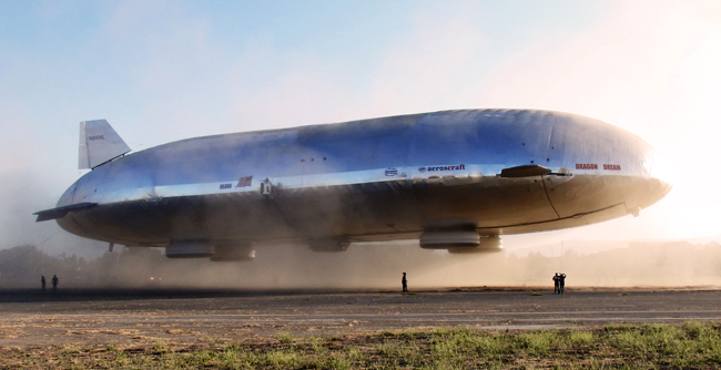 The large bag structures under airship are landing pads, a type of inflated hovercraft skirt that allow the airship to rest on the ground – or water, or ice – without wheels. Photo: Aeros Corp.