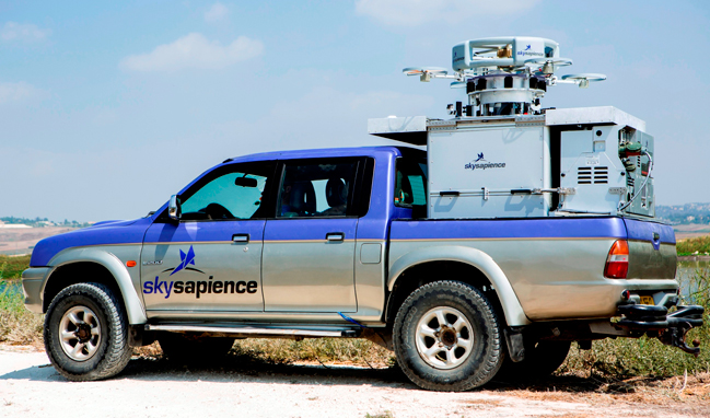Hovermast 100 tucked onto a pickup truck. The system integrates the tethered hovercraft and payload, tethered to the control system via cable that also feeds power, control and downloads sensor feeds in real time. Photo: Sky Sapience