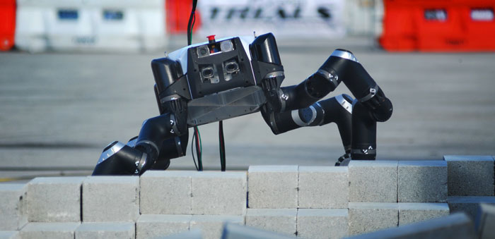 Robosimian from NASA Jet Propulsion Lab (JPL) uses four general-purpose limbs and hands, capable of both mobility and manipulation, to achieve passively stable stances, create multi-point anchored connections to supports such as ladders, railings and stair treads, and brace itself during forceful manipulation operations. Photo: DARPA