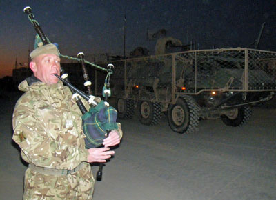 Leaving Gereshk to the bagpipe tune of Caber Feidh, played by Warrant Officer 2 (RQMS(T)) Andrew Lambert, the battlegroup moved north under blue skies and in biting temperatures. Photo: UK MOD, Crown Copyright