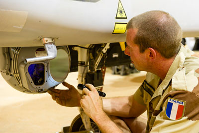 A French Air Force technician inspects the Harfang's MOSP electro-optical stabilized payload. The version of MOSP operated by the French (and possibly transferred to Morocco) includes laser target designation capability, as evident by the pictured system. Photo: French Air Force 