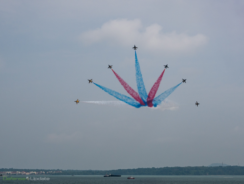 The seven-aircraft Korean T50 display team, the "Black Eagles", fan out on the final maneouver of their impressive display at Singapore Airshow rehearsal on February 9th.  