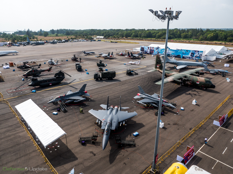 A group photo showing the Singapore Air Force military aircraft park, including F-16E, F-15SG, CH-47 Chinook, Apache AH-64D, S-70B maritime helicopter, Heron I and hermes 450 drones, Gulfstream V CAEW airborne early warning aircraft and C-130H. The RSAF is celebrating its 45th anniversary this year.