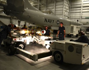 Aviation Ordnancemen assigned to Patrol Squadron (VP) 16, prepare to load a MK-54 torpedo onto a P-8A Poseidon aircraft. (Photo: U.S. Navy, by Eric A. Pastor) 