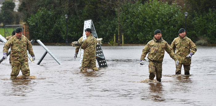 Soldiers have been working in Staines putting up a dam in a field to redirect water away from housing into fields. The soldiers are from C company Royal Ghurka Rifles. Photo: Crown Copyright