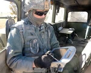 A Soldier from 3rd Cavalry Regiment programs an autonomous convoy using the AMAS system. Photo: TRADEC