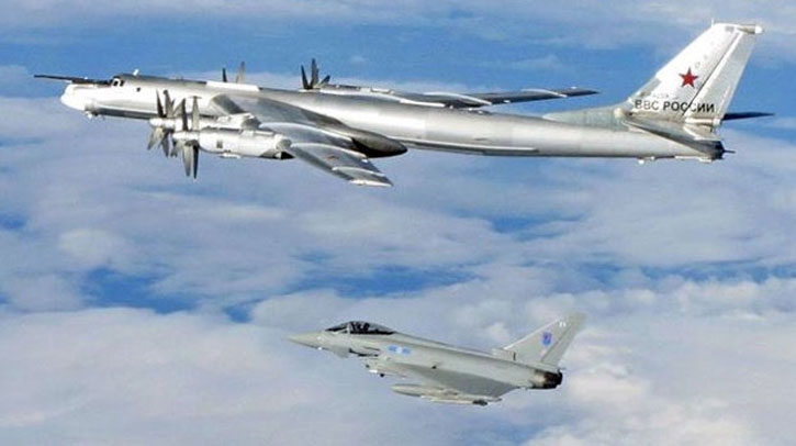 6 Squadron Typhoon from Leuchars escorts a Russian Tu-95 Bear away from British airspace. Photo: UK MOD.