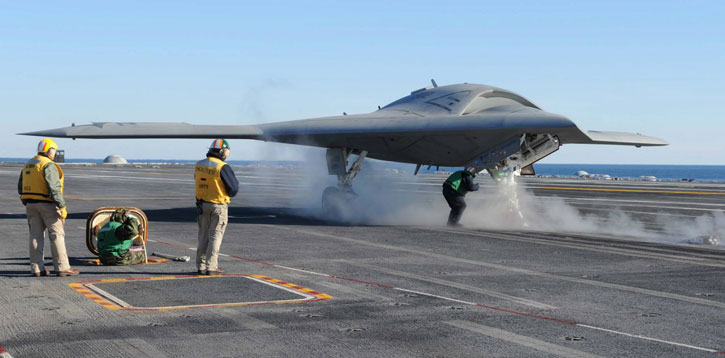 The X-47B Unmanned Combat Air System (UCAS-D) completes preparations for launching aboard the aircraft carrier USS Theodore Roosevelt (CVN 71). Theodore Roosevelt is the third carrier to test the tailless, unmanned autonomous aircraft's ability to integrate with the carrier environment. The future UCLASS will be optimized to operate with the new Ford Class carrier (CVN-78) fitted with electrically rather the conventional steam powered catapult, enabling safe handling of lighter aircraft. (U.S. Navy photo by Heath Zeigler)