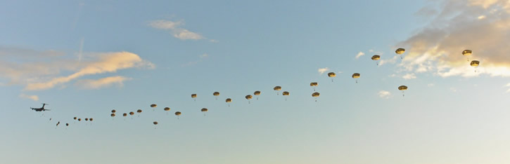 Paratroopers of the U.S. Army's 4th Brigade Combat Team (Airborne) 25th Infantry Division parachute over the Malemute Drop Zone at Joint Base Elmendorf-Richardson, in Alaska, April 2013. Photo: US Army