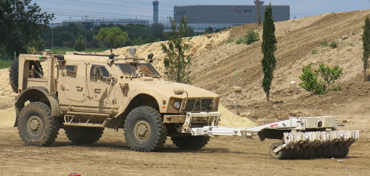 Two unmanned vehicles were demonstrated here for the first time, the Terramax from Oshkosh, is an M-ATV rigged with the Terramax autonomy kit, enabling the vehicle to demonstrate a route clearing mission performed by standard military vehicles such as the M-ATV armoured vehicle and MTVR medium trucks, equipped to carry out autonomous unmanned missions. The Terramax was demonstrated here pushing a mine roller. Photo: Tamir Eshel