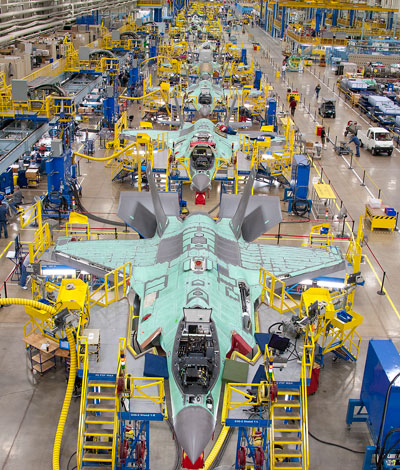 The JSF F-35 assembly line at Fort Worth, Texas. Lockheed Martin, the prime contractor, Northrop Grumman and BAE Systems, as the leading partners in the program are expected to invest $170 million improving production efficiency, toward bringing the production cost down to the level of current (fourth generation) fighter jets by 2019-2020.