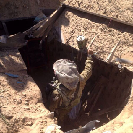 An IDF combat engineer inspects a tunnel uncovered in Gaza. Photo: IDF
