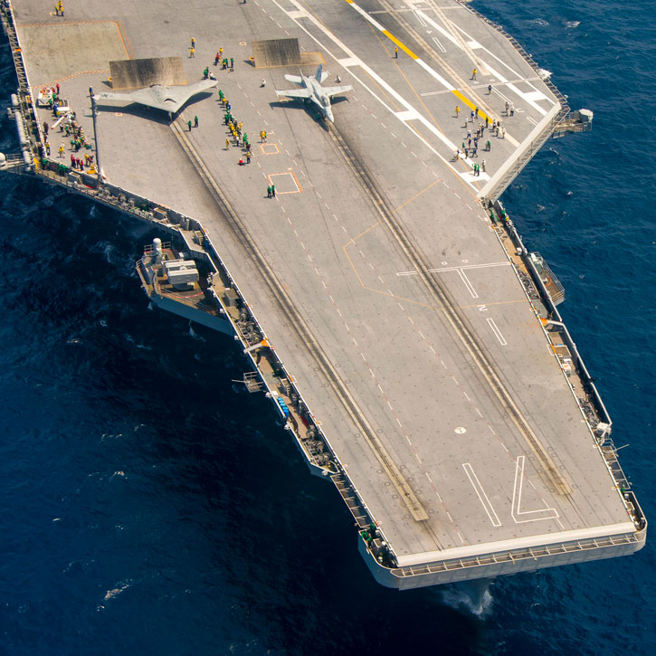 The U.S. Navy's unmanned X-47B conducts flight operations aboard the aircraft carrier USS Theodore Roosevelt (CVN 71). Photo: Northrop Grumman by Liz Wolter