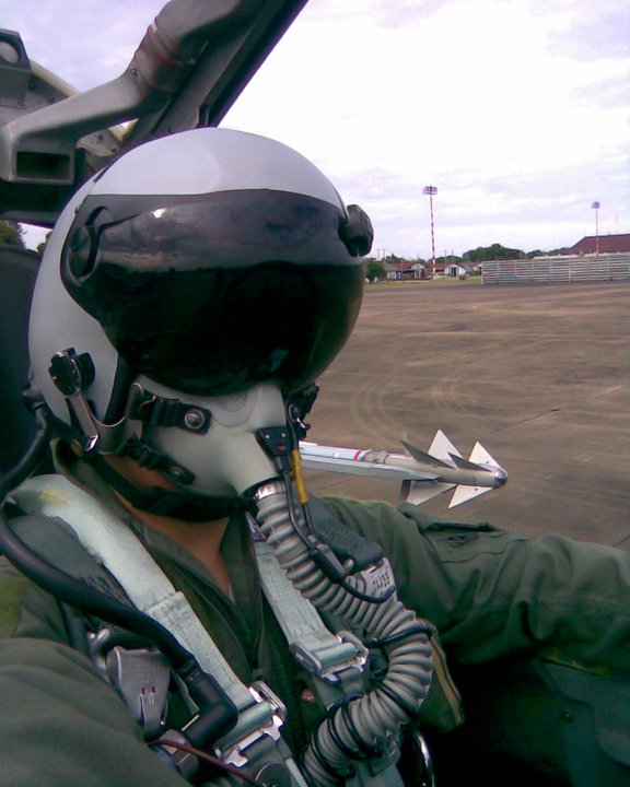 A pilot of the Royal Thai Air Force preparing for a mission in an upgraded F-5T, wearing a DASH helmet. Note the Python IV missile on the wingtip. 
