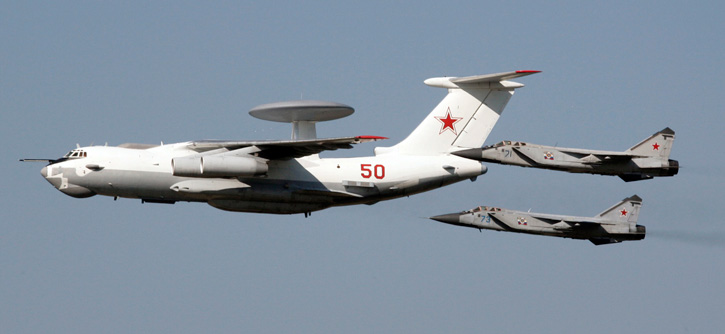 A Bereyev A-50 AEW Mainstay aircraft escorted by two MiG 31 interceptors, both operating with the Russian Air Force. The A-50, based on the IL-76 is scheduled to be replaced by the A-100, based on the new IL-476 platform, bot designed by Ilyushin.