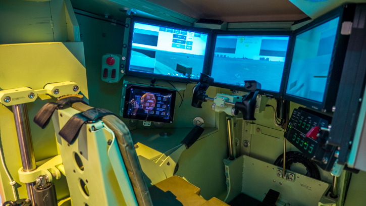 This driver's position displayed at BAE Future Technology Demonstrator for the Army Force 2025 Vision at AUSA 2014 shows the drivers' display consoles, proving 120 degrees coverage, in addition, live images from side and rear cameras provide 360 vision to the driver and commander. direct vision blocks augment this indirect view with periscope vision. Five blocks are positioned just below the raised hatch line, providing 180 degrees coverage.