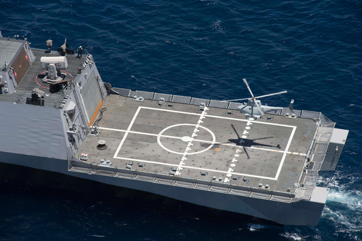 An MQ-8B Fire Scout unmanned helicopter assigned to Helicopter Maritime Strike Squadron (HSM) 35 prepares to land on the aft deck of the Littoral Combat Ship USS Freedom (LCS 1) on May 12, 2014, during a visit, board, search and seizure (VBSS) training off the coast of Southern California. The training marked the first time the littoral combat ship, an MQ-8B and an SH-60R Sea Hawk helicopter conducted integrated VBSS training. Photo: US Navy