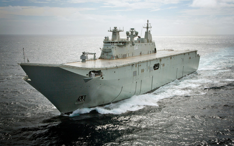 The largest ship ever built for the Royal Australian Navy, Landing Helicopter Dock NUSHIP Canberra, passes through Sydney Heads for the first time. Photo: RAN by Tom Gibson