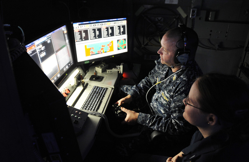 Chief Fire Controlman Brett Richmond and Lt. j.g. Katie Woodard operate the Office of Naval Research (ONR)-sponsored Laser Weapon System (LaWS) installed aboard the Afloat Forward Staging Base (Interim) USS Ponce (ASB(I) 15) during an operational demonstration in the Arabian Gulf. Directed energy weapons can counter asymmetric threats, including unmanned and light aircraft and small attack boats. Photo: U.S. Navy photo by John F. Williams