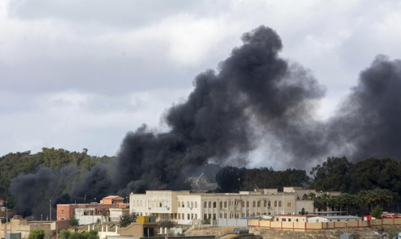 Smoke pillars over the town of Derna in Eastern Libya, after an air attack targeting ISIS aligned terrorist groups took over the city. Photo: AFP