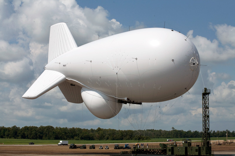 The 74 meter aerostat (243 foot) carries an air-surveillance radar that provides precise location data of airborne targets, such as cruise missiles, aircraft, unmanned aerial vehicles, and large-caliber rockets, as well as maritime surface moving targets. 