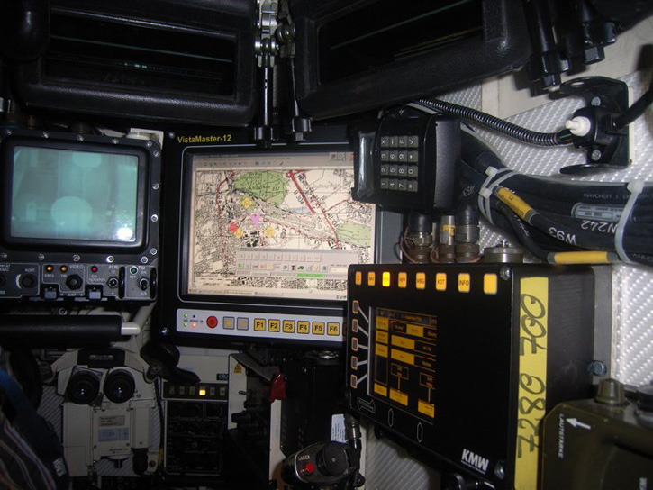 The commander's position inside the Leopard 2A7 showing the different displays of the fire control computer, tactical picture and thermal/electro-optical (day/night) sight.