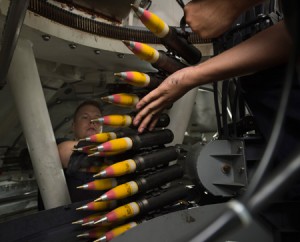 Gunners load high-explosive incendiary tracer rounds into the ammunition feeder-can of a 30mm weapons system aboard the littoral combat ship USS Fort Worth (LCS 3). Photo: U.S. Navy, by Antonio Turretto 