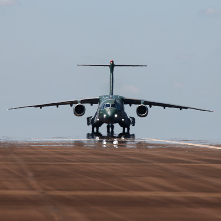 KC-390 lines up on the runway before takeoff.