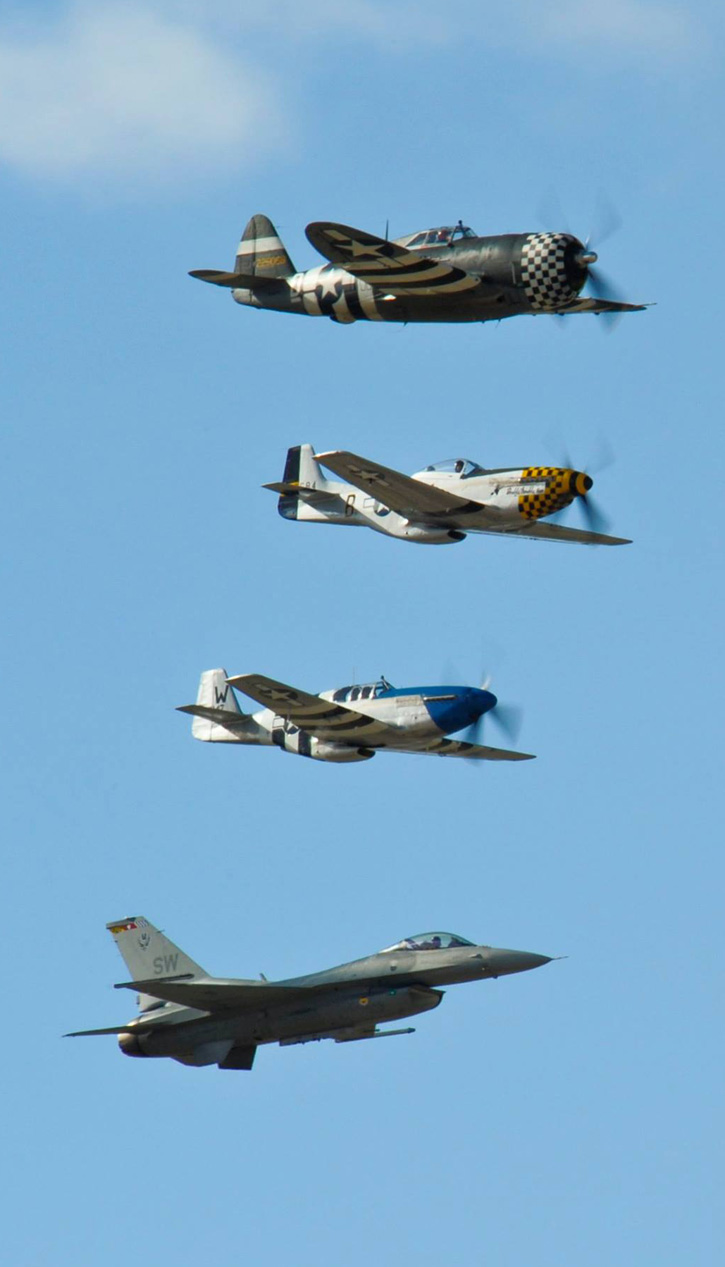 A P-47 Thunderbolt, two P-51 Mustangs and F-16 Fighting Falcon fly in formation during the 2015 Heritage Flight Training and Certification Course at Davis-Monthan Air Force Base, Ariz., Feb. 28, 2015. USAF photo by Chris Massey