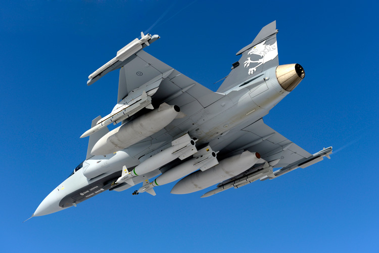 This weapon configuration of Gripen NG shows two IRIS-T short range missiles carried on the wing tips, two METEOR BVR missiles underwing and two laser guided bombs carried under the fuselage. Two external fuel tanks are used for increased mission endurance. Photo: SAAB