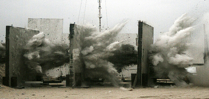 A sled test demonstrating the penetration of multiple reinforced concrete walls by IMI MPR-500 bomb, used as the high performance warhead for many guided weapons kits. Photo: IMI. 