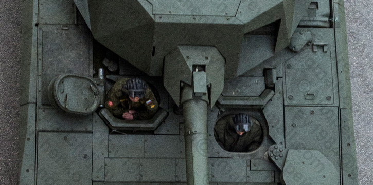The crew seating arrangement in the T-14. The commander is in the right side position, the driver in the left and gunner in the position with closed hatch behind the driver. The turret must be turned sideways to enable the gunner to open his hatch. It is likely that in emergency he can escape from the driver's hatch. 