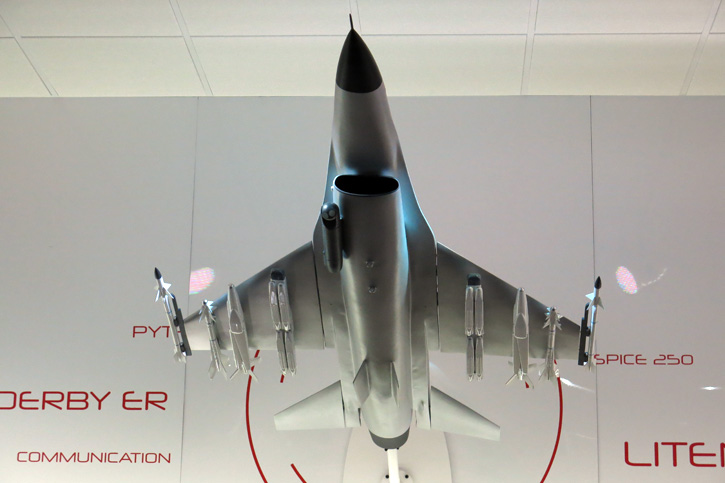 An F-16 model at Rafael's display at the Paris Air Show 2015 showing a full loadout supporting stand-off attack at ranges of 100+ km. This loadout comprises a Litening 5 long-range targeting pod and eight Spice 250, each capable of hitting pinpoint target at long ranges. The configuration also includes two Spice 1000 EO precision guided weapons, two I-Derby ER missiles with range of +100 km and two Python 5 air/air missiles. The aircraft is also networked with other airborne or surface based elements through the broadband, multi-channel BNET communications system. Photo: Tamir Eshel, Defense-Update. 